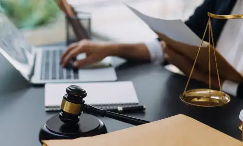 An Okechobee bankruptcy lawyer works on their computer. 